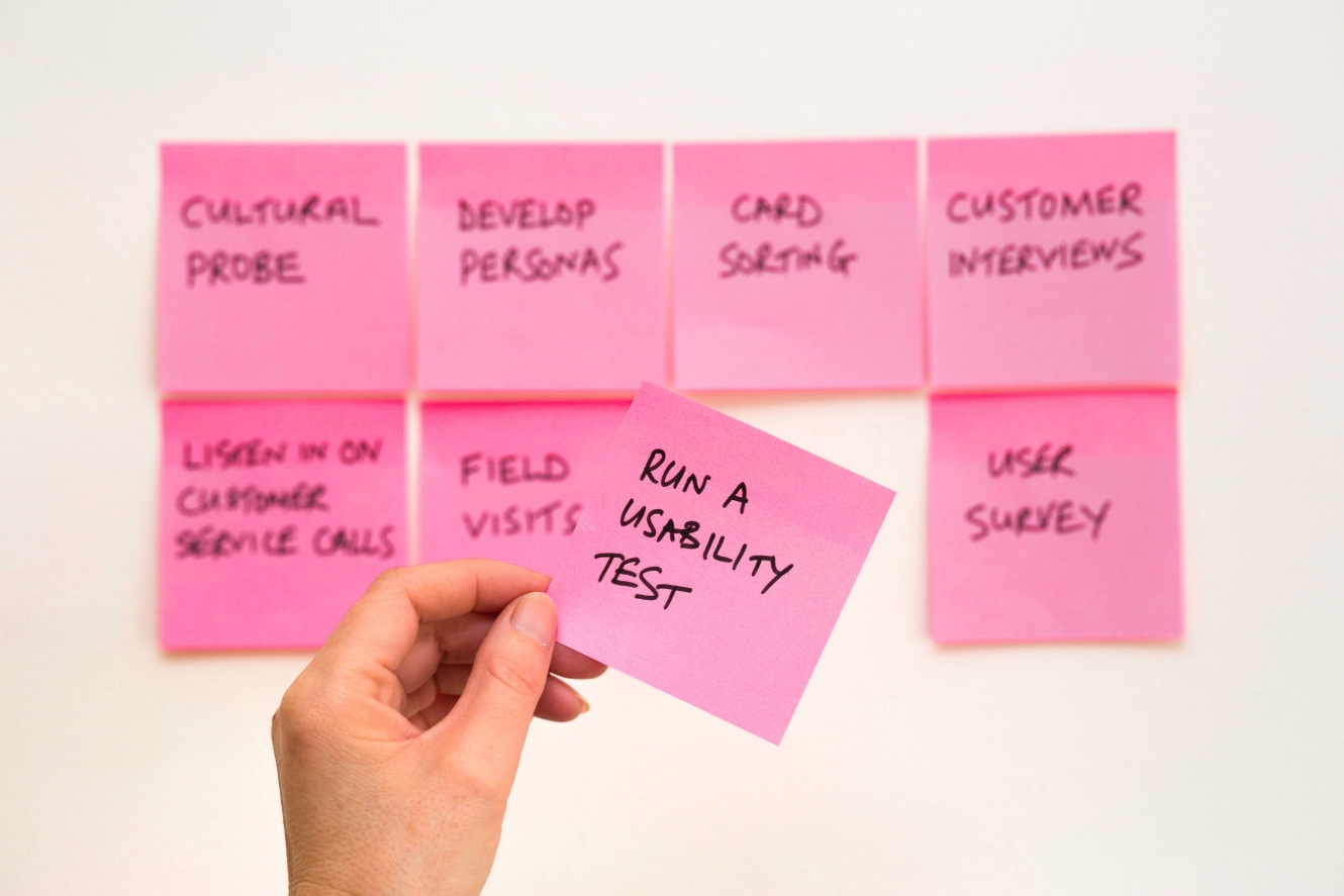 Manager looks at business ideas on sticky notes